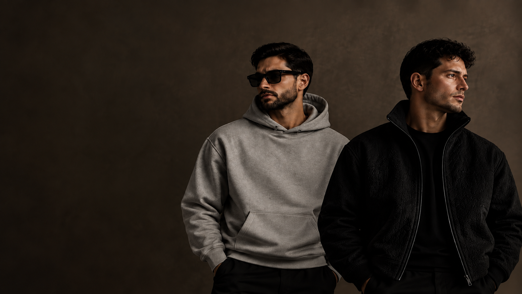 Different Level winter campaign with two male models positioned slightly lower in frame against a dark studio background.